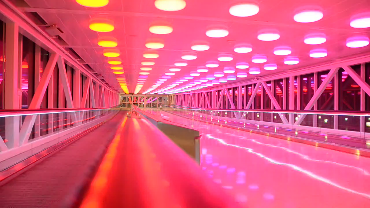 Motion-activated lighting display in the pedestrian walkway that links between the Indianapolis International Airport parking garage and Colonel H. Weir Cook Terminal, Indianapolis, Indiana, USA by [https://www.flickr.com/photos/aikos/ Aiko, Thomas & Juliette+Isaac] from [https://www.flickr.com/photos/aikos/albums/72157622640225031 Indianapolis Airport]